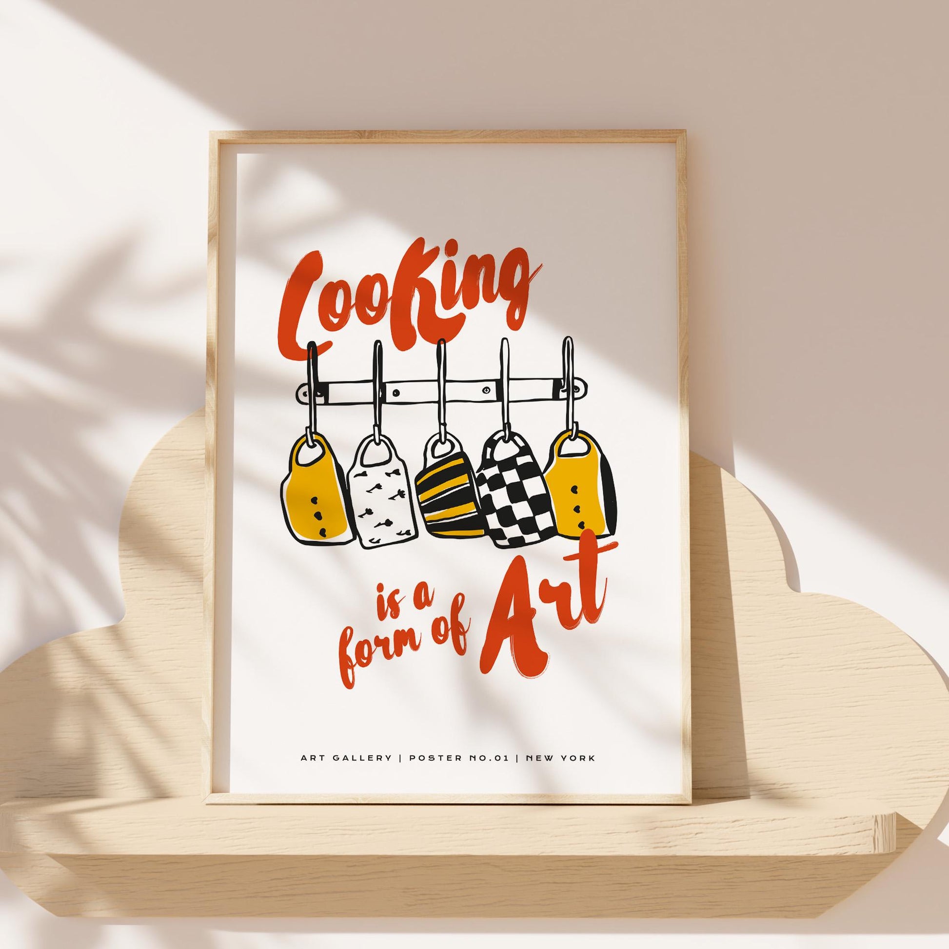 Chef gift wall art showing cooking is art design with colorful kitchen tools and orange typography