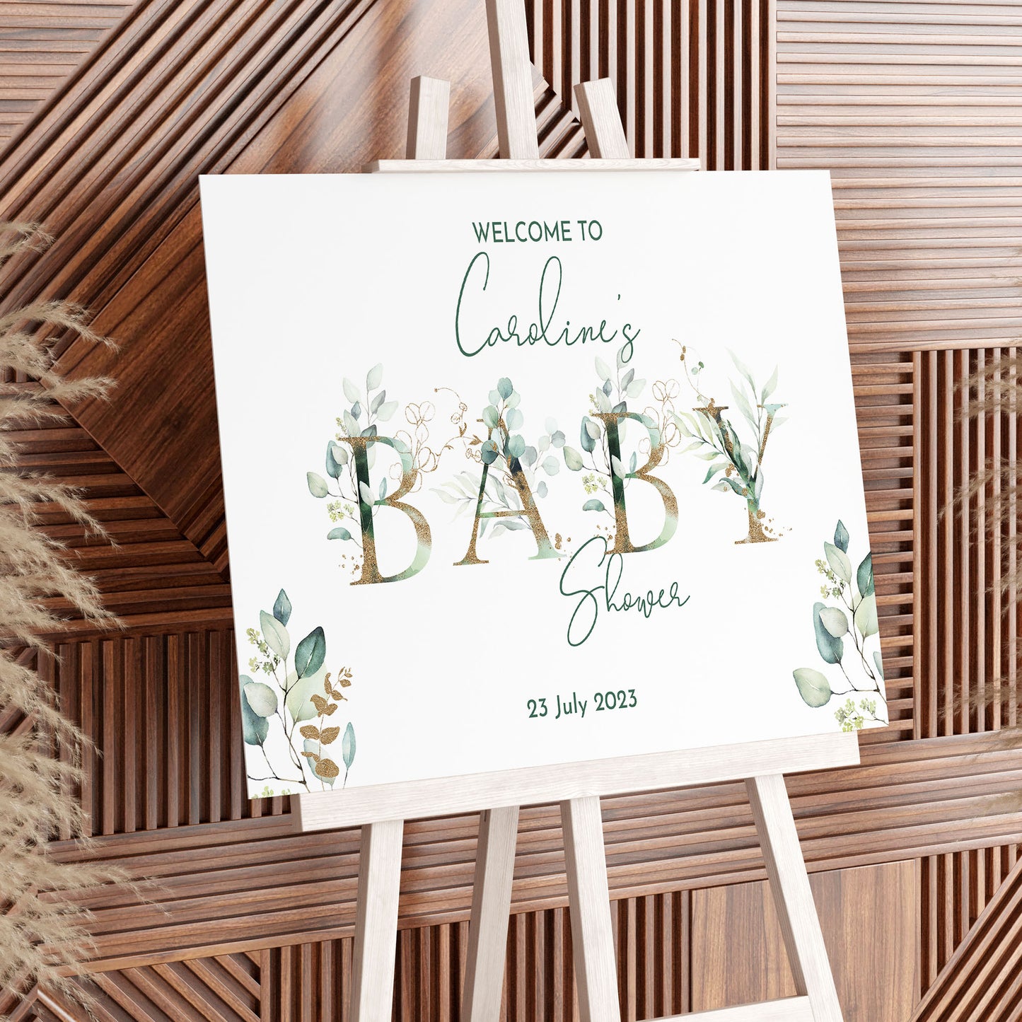 white foamboard baby shower sign with a eucalyptus theme