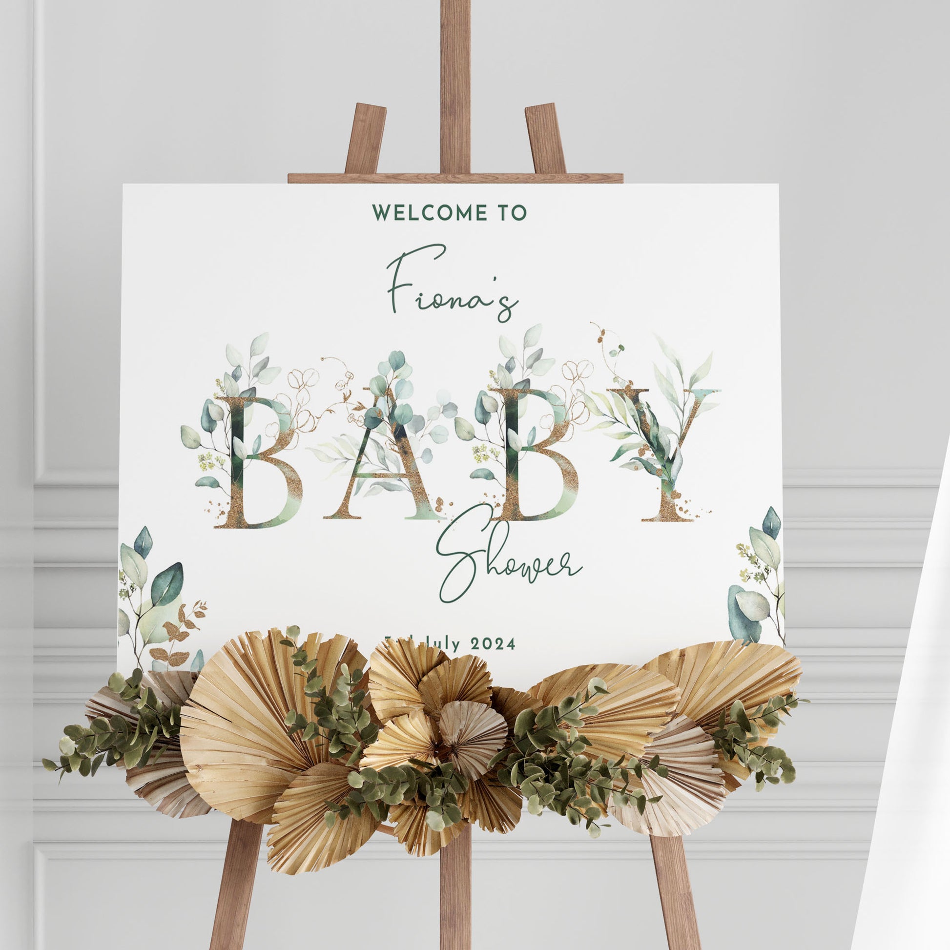 white foamboard baby shower sign with a eucalyptus theme